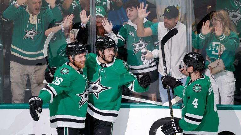 Dallas Stars centre Wyatt Johnston, centre, celebrates his first period goal with Joe Pavelski (16) and Miro Heiskanen (4) during Game 7 of an NHL hockey Stanley Cup first-round playoff series against the Vegas Golden Knights, Sunday, May 5, 2024, in Dallas. (Brandon Wade/AP)