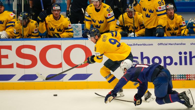 Sweden's Adrian Kempe, left, challenges for a puck with United States' Matt Boldy during the preliminary round match between Sweden and United States at the Ice Hockey World Championships in Ostrava, Czech Republic, Friday, May 10, 2024. (Darko Vojinovic/AP)