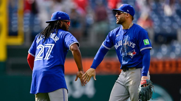 Toronto Blue Jays' Vladimir Guerrero Jr. (27) and George Springer celebrate their team's victory following a baseball game against the Philadelphia Phillies, Wednesday, May 8, 2024, in Philadelphia. (Derik Hamilton/AP)