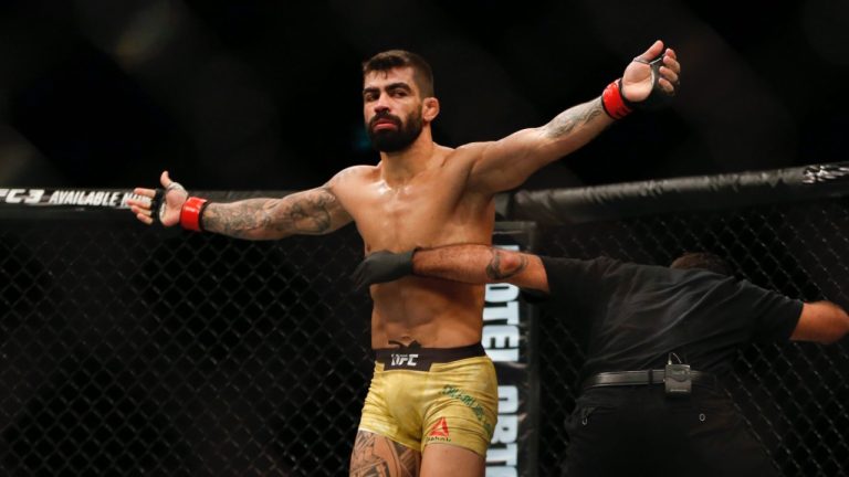 Elizeu Zaleski dos Santos, from Brazil, celebrates after defeating Sean Strickland in their UFC welterweight mixed martial arts bout in Rio de Janeiro in 2018. (Leo Correa/AP)