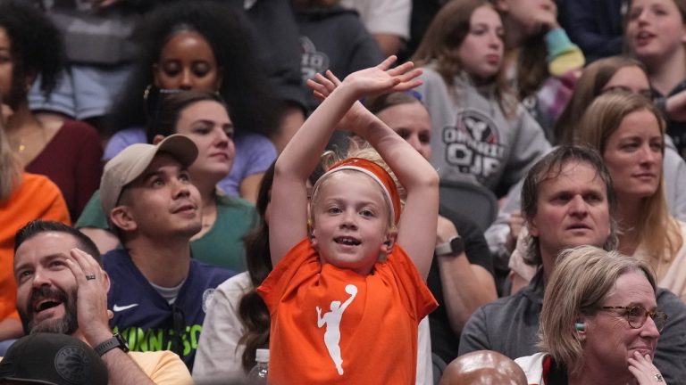 A young fan wears a WNBA t-shirt in the stands as she watches the Chicago Sky take on the Minnesota Lynx in WNBA preseason basketball action in Toronto on Saturday May 13, 2023. (CP/Chris Young)