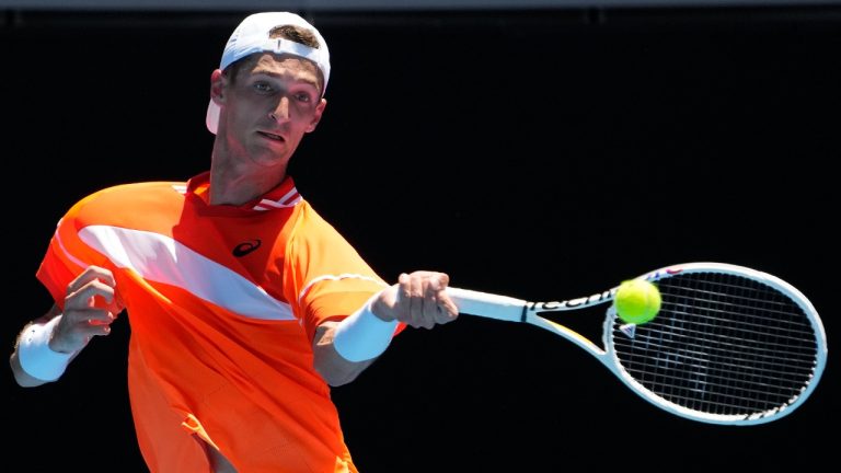 FILE - Terence Atmane, of France, plays a forehand return to Daniil Medvedev, of Russia, during a first-round match at the Australian Open tennis championships at Melbourne Park, Melbourne, Australia, Jan. 15, 2024. Atmane was allowed to continue his first-round match at the French Open, Sunday, May 26, 2024, without being penalized after hitting a ball angrily and accidentally striking a spectator in the stands at one of the event's smaller courts. (Andy Wong/AP)