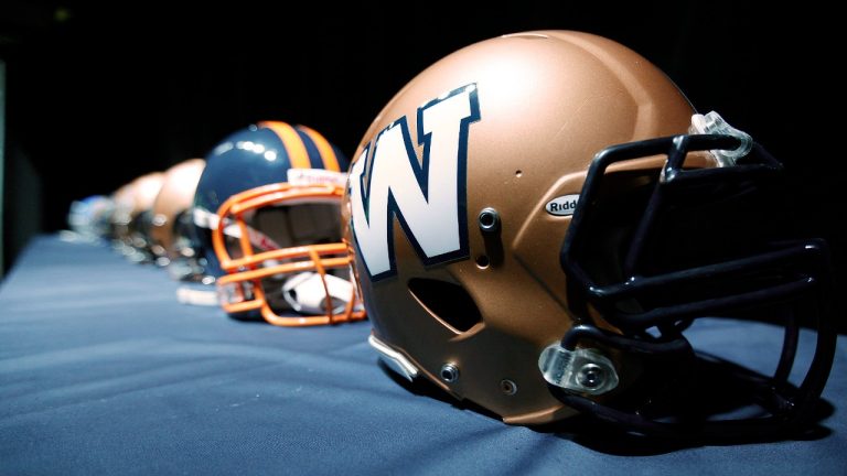 The new Winnipeg Blue Bombers 1980s-style logo is unveiled at a press conference at Canada Inn Stadium in Winnipeg, Tuesday, April 24, 2012. (John Woods/CP)