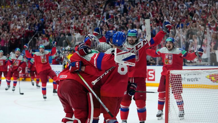 Czechia's goalkeeper Lukas Dostal, front left, celebrates with teammates after the semifinal match between Czechia and Sweden at the Ice Hockey World Championships in Prague, Czechia, Saturday, May 25, 2024. (Petr David Josek/AP)