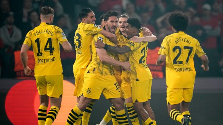 Dortmund's Mats Hummels, centre, celebrates with teammates after scoring his sides first goal during the Champions League semifinal second leg soccer match between Paris Saint-Germain and Borussia Dortmund at the Parc des Princes stadium in Paris, France, Tuesday, May 7, 2024. (Christophe Ena/AP Photo)