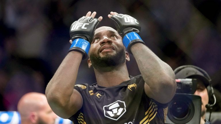 UFC fighter Leon Edwards, of Jamaica, celebrates his title as welterweight champion of the world after knocking out Nigerian UFC fighter Kamaru Usman during the UFC 278 mixed martial arts title bout in Salt Lake City on Saturday, Aug. 20, 2022. (Francisco Kjolseth/The Salt Lake Tribune via AP)