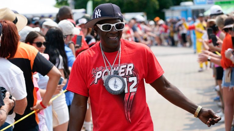 Entertainer Flavor Flav greets fans before the IndyCar Detroit Grand Prix auto race in Detroit, Sunday, June 4, 2023. (Paul Sancya/AP)