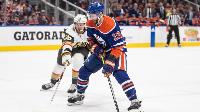 Vegas Golden Knights' Anthony Mantha (39) and Edmonton Oilers' Adam Henrique (19) battle for the puck during first period NHL action in Edmonton on Wednesday April 10, 2024. (Jason Franson/CP)