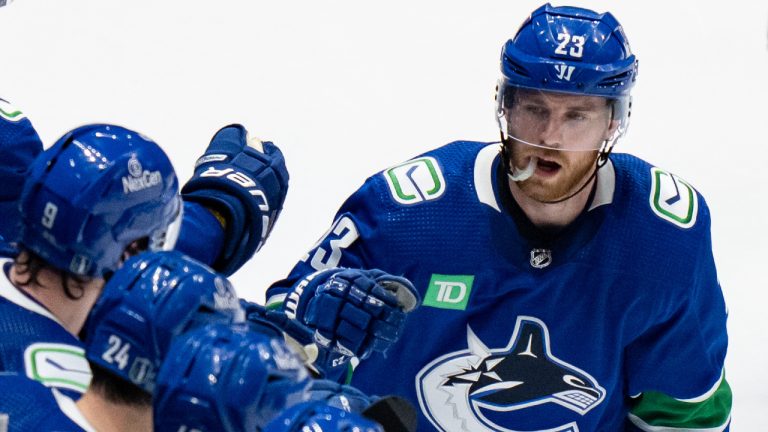 Vancouver Canucks' Elias Lindholm celebrates with his teammates after his goal against the Edmonton Oilers during the second period in Game 1 of an NHL hockey Stanley Cup second-round playoff series, in Vancouver, on Wednesday, May 8, 2024. (Ethan Cairns/CP)