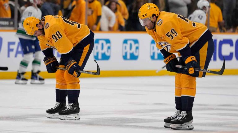 Nashville Predators center Ryan O'Reilly (90) and defenseman Roman Josi (59) skate off the ice after the team 2-1 loss against the Vancouver Canucks in Game 3 of an NHL hockey Stanley Cup first-round playoff series. (George Walker IV/AP)