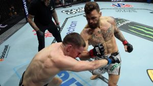 (R-L) Mauricio Ruffy of Brazil punches Jamie Mullarkey of Australia in a lightweight bout during the UFC 301 event at Farmasi Arena on May 04, 2024 in Rio de Janeiro, Brazil. (Alexandre Loureiro/Zuffa LLC via Getty Images)