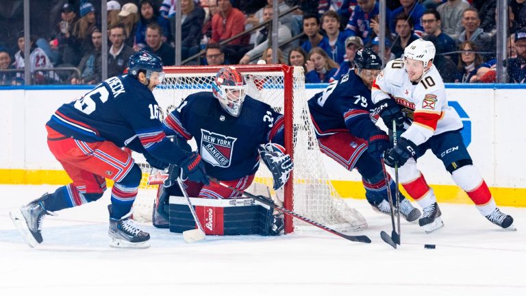 Florida Panthers right wing Vladimir Tarasenko (10) is defended by New York Rangers' K'Andre Miller (79) and Vincent Trocheck (16) during the second period of an NHL hockey game on Saturday, March 23, 2024, in New York. (Peter K. Afriyie/AP)