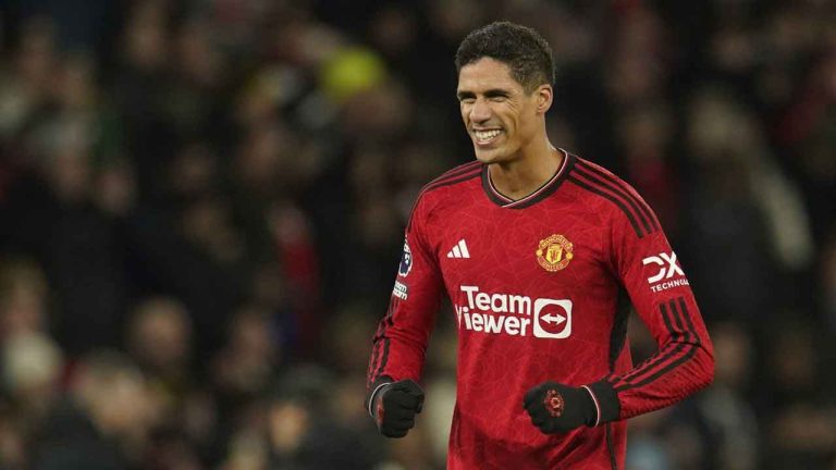 Manchester United's Raphael Varane celebrates on the full time during the English Premier League soccer match between Manchester United and Aston Villa at the Old Trafford stadium in Manchester, England. (Dave Thompson/AP)