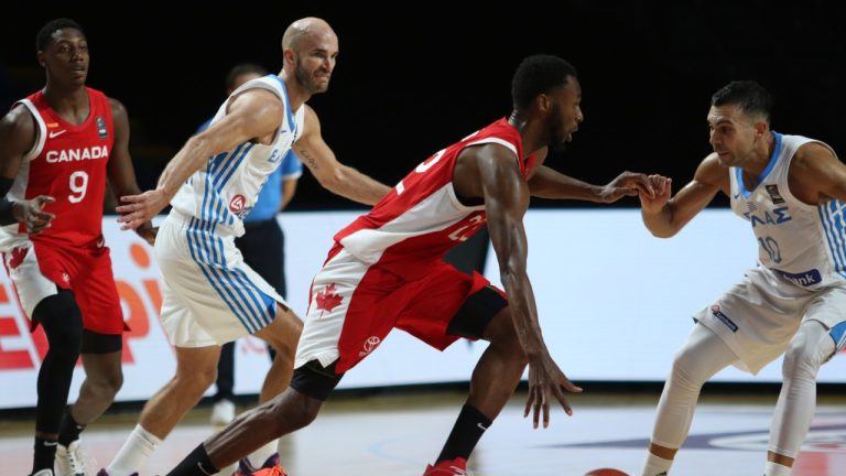 Canada's Andrew Wiggins looks for an open man as Greece players try to steal during second half FIBA Men's Olympic Qualifying basketball action at Memorial Arena in Victoria, Tuesday, June 29, 2021. (Chad Hipolito/THE CNAADIAN PRESS)