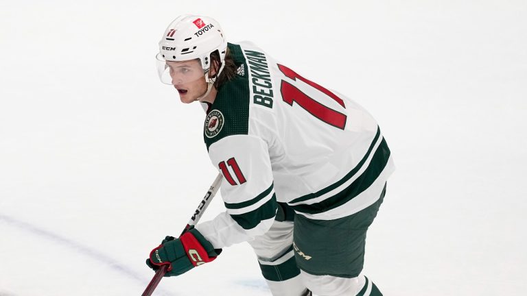 Minnesota Wild left wing Adam Beckman controls the puck during a preseason NHL hockey game against the Dallas Stars, Tuesday, Sept. 26, 2023, in Dallas. (AP Photo/Tony Gutierrez)