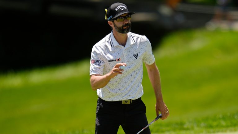 Adam Hadwin waves after putting on the fourth green during the final round of the Memorial golf tournament, Sunday, June 9, 2024, in Dublin, Ohio. (Sue Ogrocki/AP)