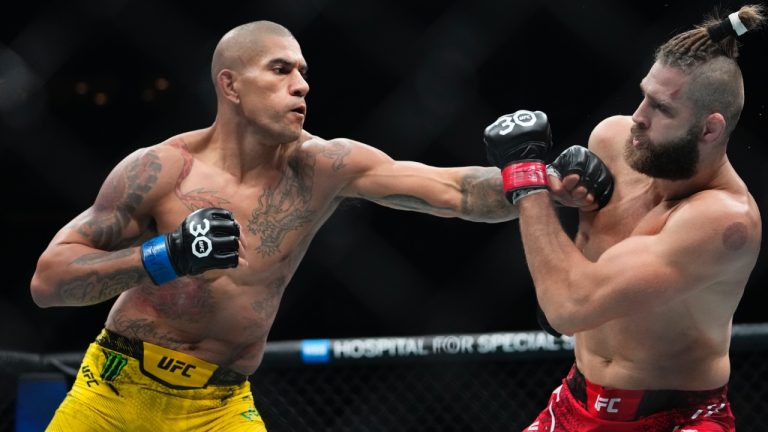 Alex Pereira, left, punches Jirí Procházka during a light-heavyweight title bout at UFC 295 in New York's Madison Square Garden. (Frank Franklin II/AP)