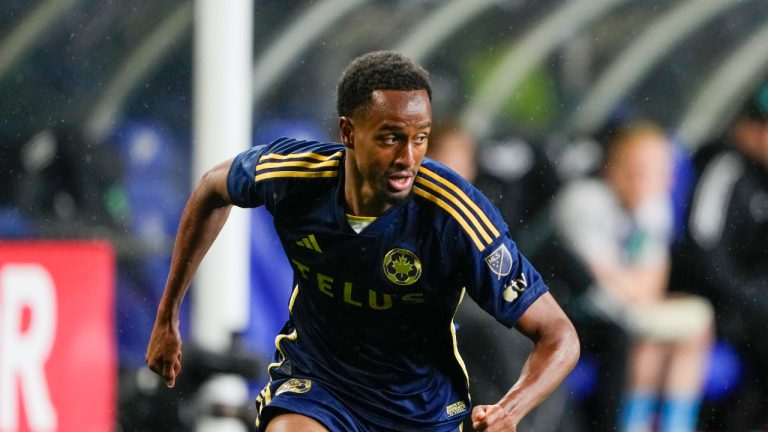 Vancouver Whitecaps forward Ali Ahmed runs against the Seattle Sounders during the second half of an MLS soccer match Saturday, May 18, 2024, in Seattle. (Lindsey Wasson/AP)