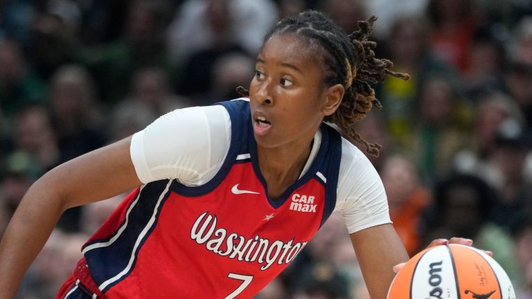 Washington Mystics' Ariel Atkins moves the ball in a game against the Seattle Storm, May 25, 2024. (AP Photo/Lindsey Wasson)