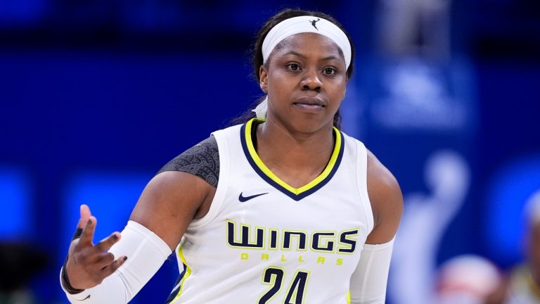 Dallas Wings guard Arike Ogunbowale (24) celebrates after sinking a three-point shot against the Minnesota Lynx during a WNBA game, June 27, 2024. (AP Photo/Tony Gutierrez)