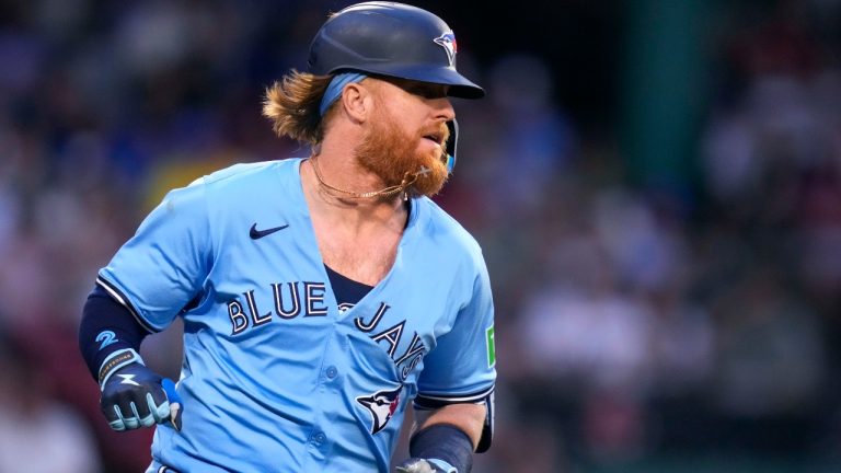 Toronto Blue Jays' Justin Turner dashes down the first base line on his RBI single during the fourth inning of a baseball game against the Boston Red Sox at Fenway Park, Monday, June 24, 2024, in Boston. (Charles Krupa/AP)