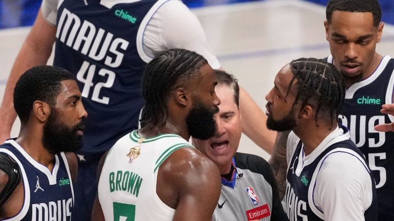 Celtics guard Jaylen Brown and Mavericks forward Derrick Jones Jr. exchange words during Game 4 of the NBA Final. June 14, 2024. (AP Photo/Julio Cortez)