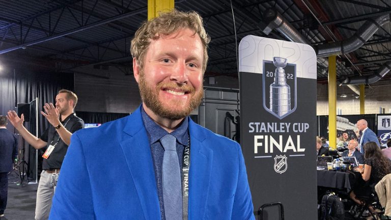 FILE - Brice Christianson poses for a photo after interpreting NHL Commissioner Gary Bettman's annual state of the league news conference from English into American Sign Language. (AP Photo/Stephen Whyno, file)