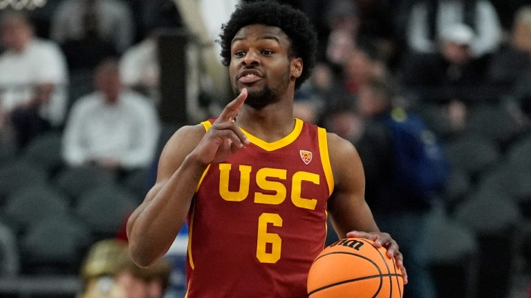 Southern California's Bronny James (6) drives up the court against Washington during the first half of an NCAA college basketball game in the first round of the Pac-12 tournament Wednesday, March 13, 2024, in Las Vegas. (AP Photo/John Locher)