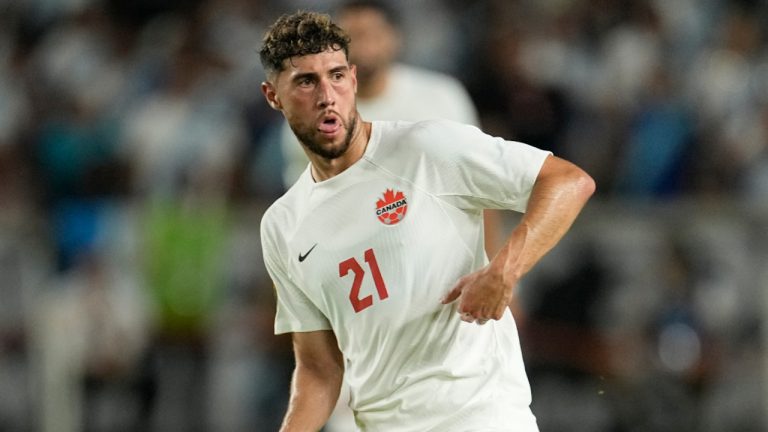 Canada's Jonathan Osorio (21) runs up the field during the second half of a CONCACAF Gold Cup soccer match against Guatemala Saturday, July 1, 2023, in Houston. (David J. Phillip/AP) 