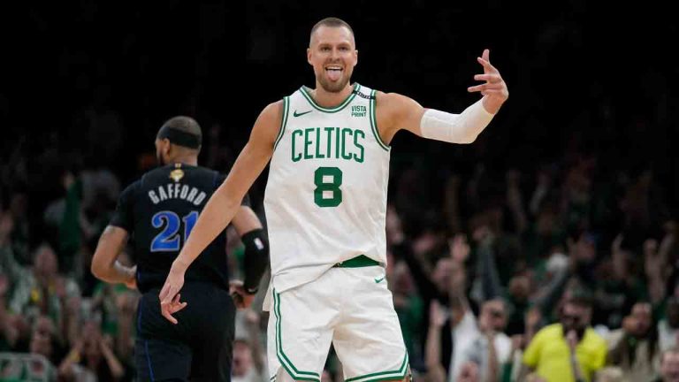 Boston Celtics centre Kristaps Porzingis (8) celebrates in front of Dallas Mavericks center Daniel Gafford (21) during the first half of Game 1 of basketball's NBA Finals on Thursday, June 6, 2024, in Boston. (Charles Krupa/AP)