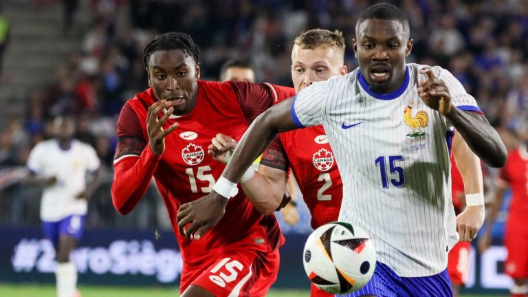 France's Marcus Thuram, right, duels for the ball with Canada's Alistair Johnston, centre, and Canada's Moise Bombito during the international friendly soccer match between France and Canada at the Matmut Atlantique stadium in Bordeaux, southwestern France, Sunday, June 9, 2024. (AP)