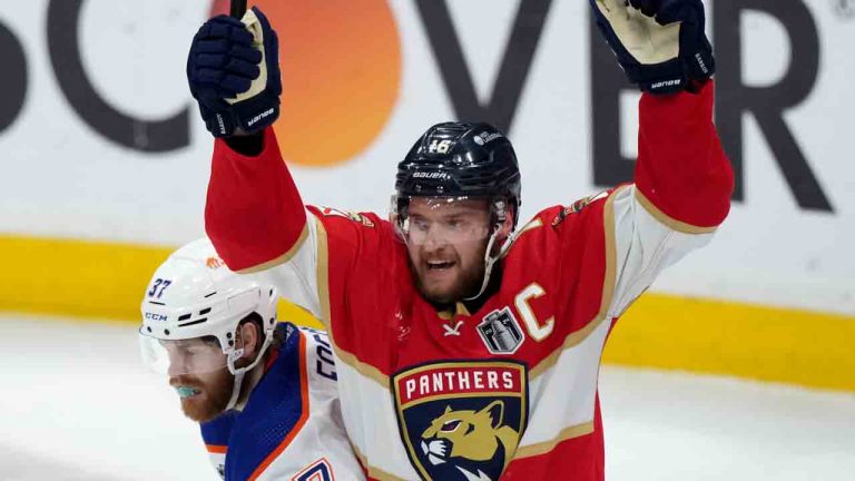 Florida Panthers forward Aleksander Barkov (16) celebrates Florida Panthers' second goal of the game as Edmonton Oilers forward Warren Foegele (37) reacts during second period game 7 of the NHL Stanley Cup finals in Sunrise, Fla., on Monday, June 24, 2024. (Nathan Denette/CP)