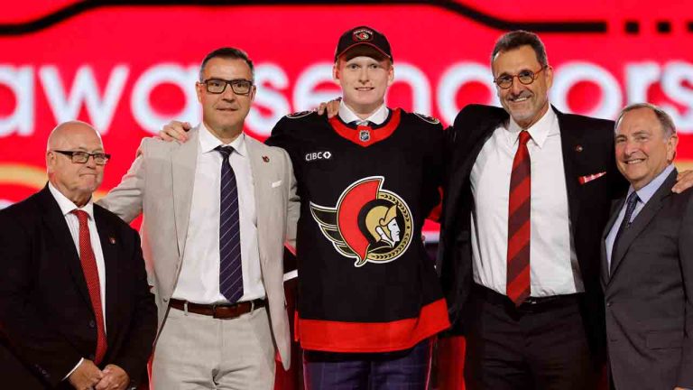 Carter Yakemchuk, center, poses after being selected by the Ottawa Senators during the first round of the NHL hockey draft Friday, June 28, 2024, in Las Vegas. (Steve Marcus/AP)