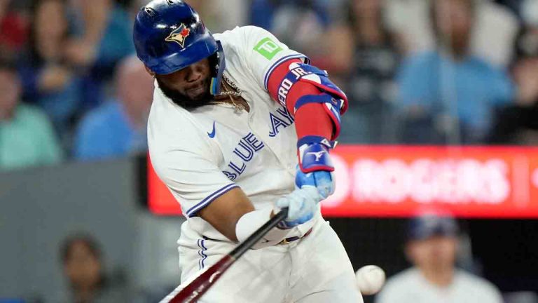 Toronto Blue Jays first base Vladimir Guerrero Jr. (27) hits a two-run home run during first inning American League MLB baseball action against the New York Yankees, in Toronto, Saturday, June 29, 2024. (Frank Gunn/CP)