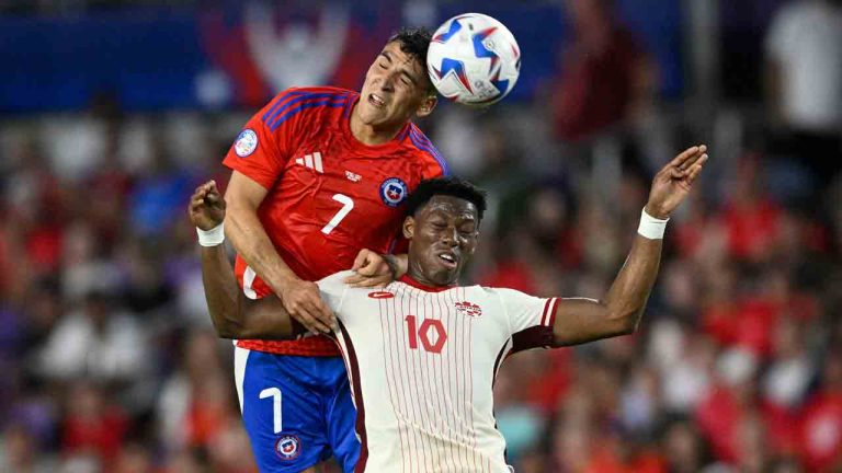 Chile's Marcelino Nunez, top, heads the ball over Canada's Jonathan David during a Copa America Group A soccer match in Orlando, Fla., Saturday, June 29, 2024. (Phelan Ebenhack/AP)