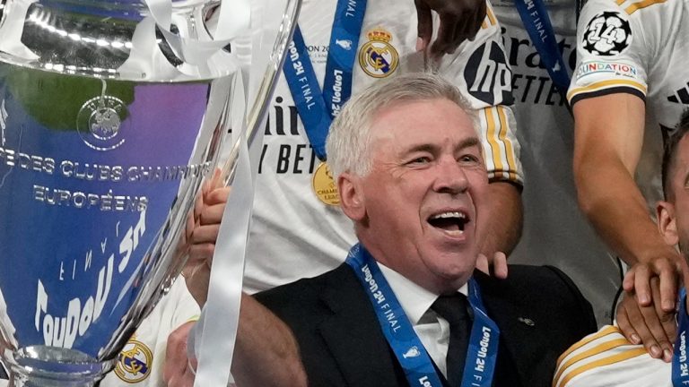 Real Madrid's head coach Carlo Ancelotti celebrates with the players after winning the Champions League final. Sunday, June 2, 2024. (AP Photo/Frank Augstein)