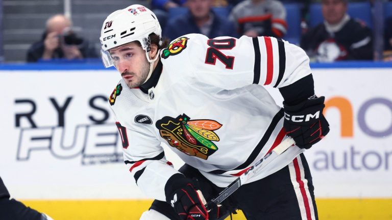 Chicago Blackhawks' Cole Guttman skates with the puck during a game against the Buffalo Sabres, Jan. 18, 2024. (AP Photo/Jeffrey T. Barnes)