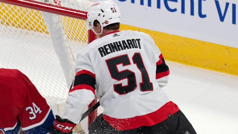 Montreal Canadiens' Jake Allen makes a save against Ottawa Senators Cole Reinhardt during an NHL preseason game. Sept. 27, 2023. (The Canadian Press/Christinne Muschi)