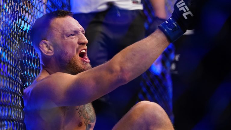 Conor McGregor seen yelling as he sits on the mat after an injury during his lightweight mixed martial arts bout with Dustin Poirier at UFC 264 in 2021 in Las Vegas. (John Locher/AP)