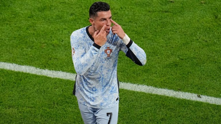 Portugal's Cristiano Ronaldo gestures as he leaves the pitch at half time during a Group F match between Georgia and Portugal at the Euro 2024 soccer tournament in Gelsenkirchen, Germany, Wednesday, June 26, 2024. (AP Photo/Andreea Alexandru)