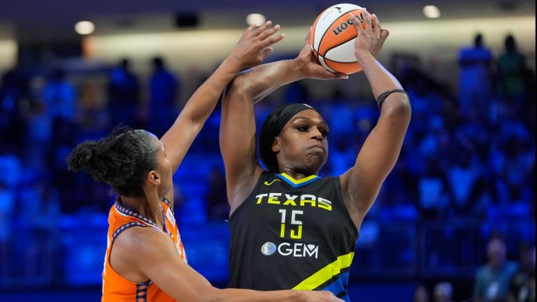 Dallas Wings center Teaira McCowan (15) keeps the ball from Connecticut Sun forward Alyssa Thomas (25) during the first half of a WNBA basketball basketball game in Arlington, Texas, Saturday, June 15, 2024. (AP Photo/LM Otero)