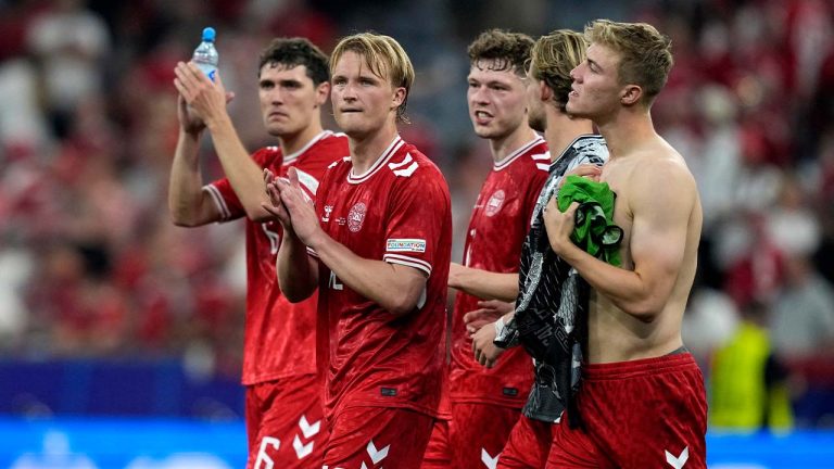 Denmark's Andreas Christensen (6), Kasper Dolberg (12) and teammates react after a Group C match between Denmark and Serbia at the Euro 2024 soccer tournament in Munich, Germany, Tuesday, June 25, 2024. (Antonio Calanni/AP)