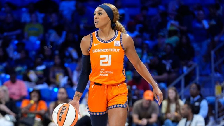 Connecticut Sun guard DiJonai Carrington dribbles during a WNBA game against the Dallas Wings, June 15, 2024. (AP Photo/LM Otero)