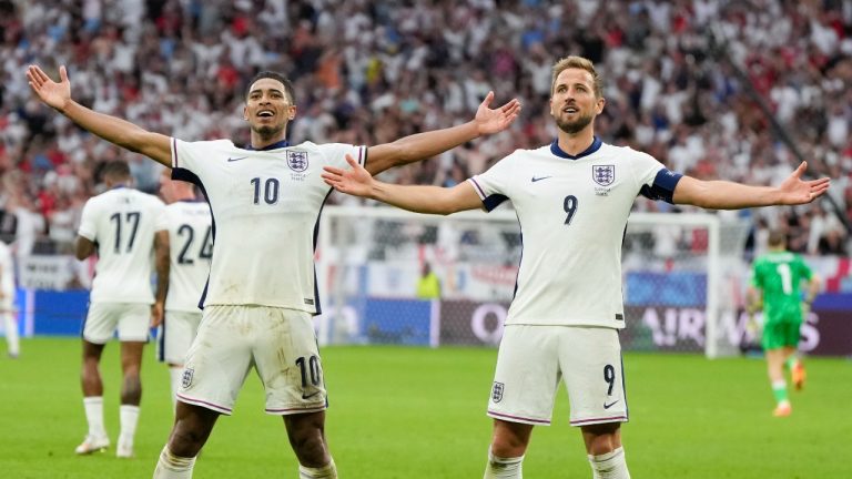 England's Jude Bellingham, left, celebrates his goal with Harry Kane during a round of sixteen match between England and Slovakia at the Euro 2024 soccer tournament in Gelsenkirchen, Germany, Sunday, June 30, 2024. (Matthias Schrader/AP)