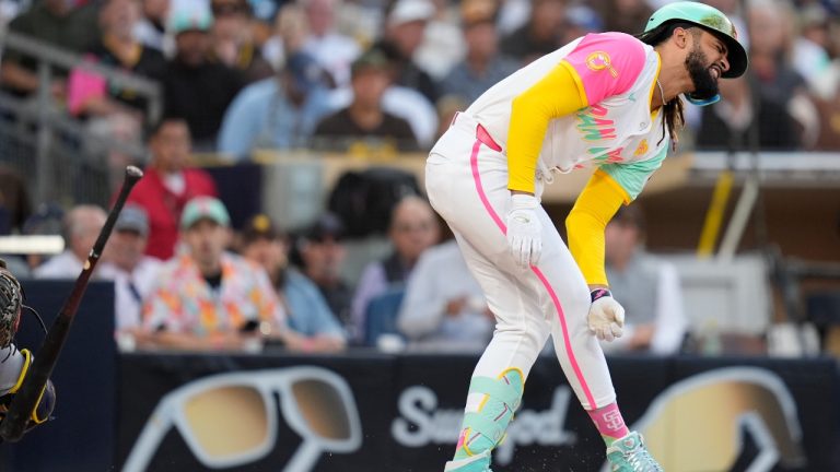 San Diego Padres' Fernando Tatis Jr. grimaces after being hit by a pitch during the third inning of a baseball game against the Milwaukee Brewers, Friday, June 21, 2024, in San Diego. (Gregory Bull/AP)