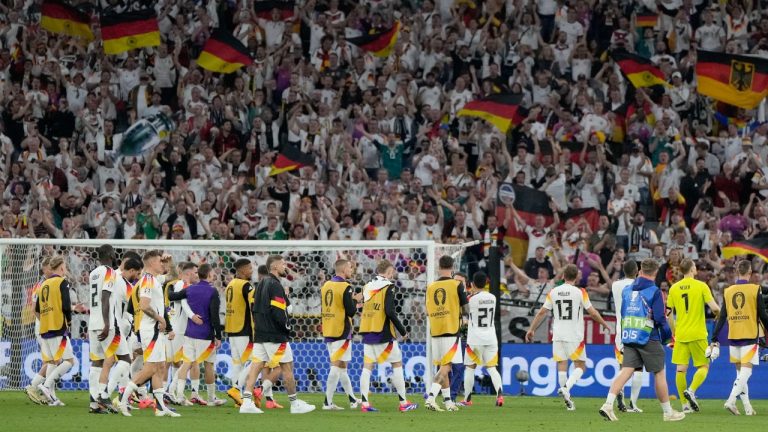 German players celebrate in front of their fans after a match against Scotland at the Euro 2024 tournament. June 14, 2024. (AP Photo/Matthias Schrader)