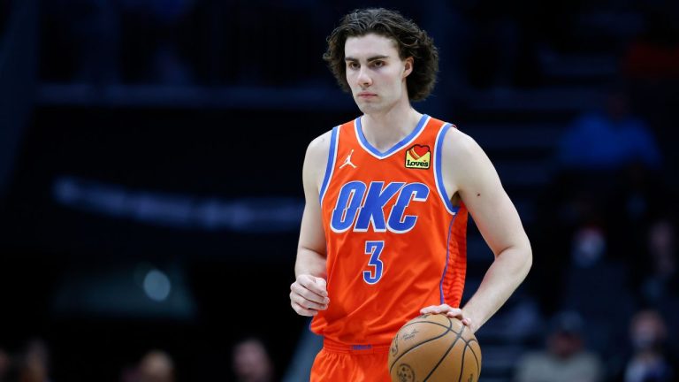 Oklahoma City Thunder guard Josh Giddey brings the ball up court against the Charlotte Hornets during the second half of an NBA basketball game in Charlotte, N.C., Sunday, April 7, 2024. (Nell Redmond/AP Photo)