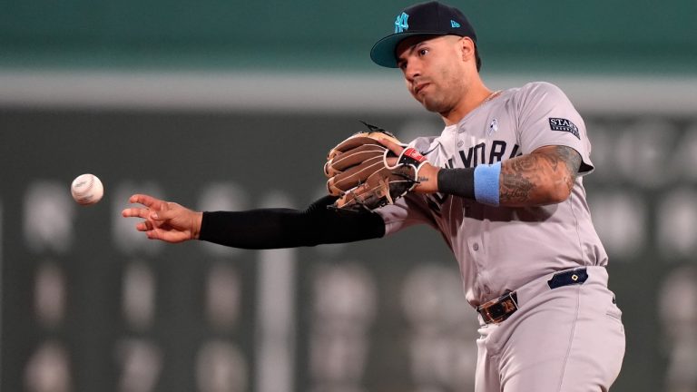 New York Yankees second baseman Gleyber Torres throws to first to retire Boston Red Sox's Masataka Yoshida in the fifth inning of a baseball game, Sunday, June 16, 2024, in Boston. (Steven Senne/AP)