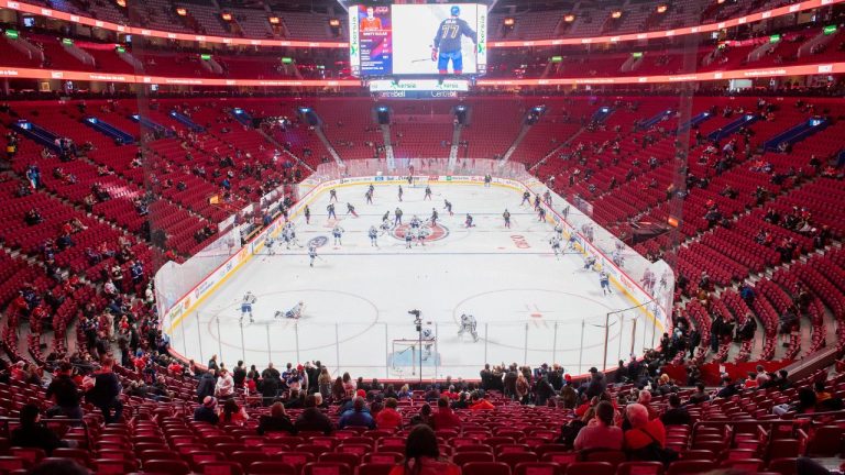 The Montreal Canadiens and the Toronto Maple Leafs skate before a half capacity crowd at the Bell Centre in Montreal, Monday, Feb. 21, 2022, prior to an NHL hockey game. (Graham Hughes/CP Photo)