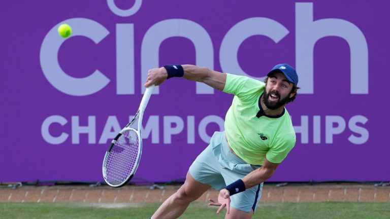 Jordan Thompson of Australia serves to Andy Murray of Britain during their singles match on day five of The Queen's Club tournament, June 19, 2024. (Kirsty Wigglesworth/AP)